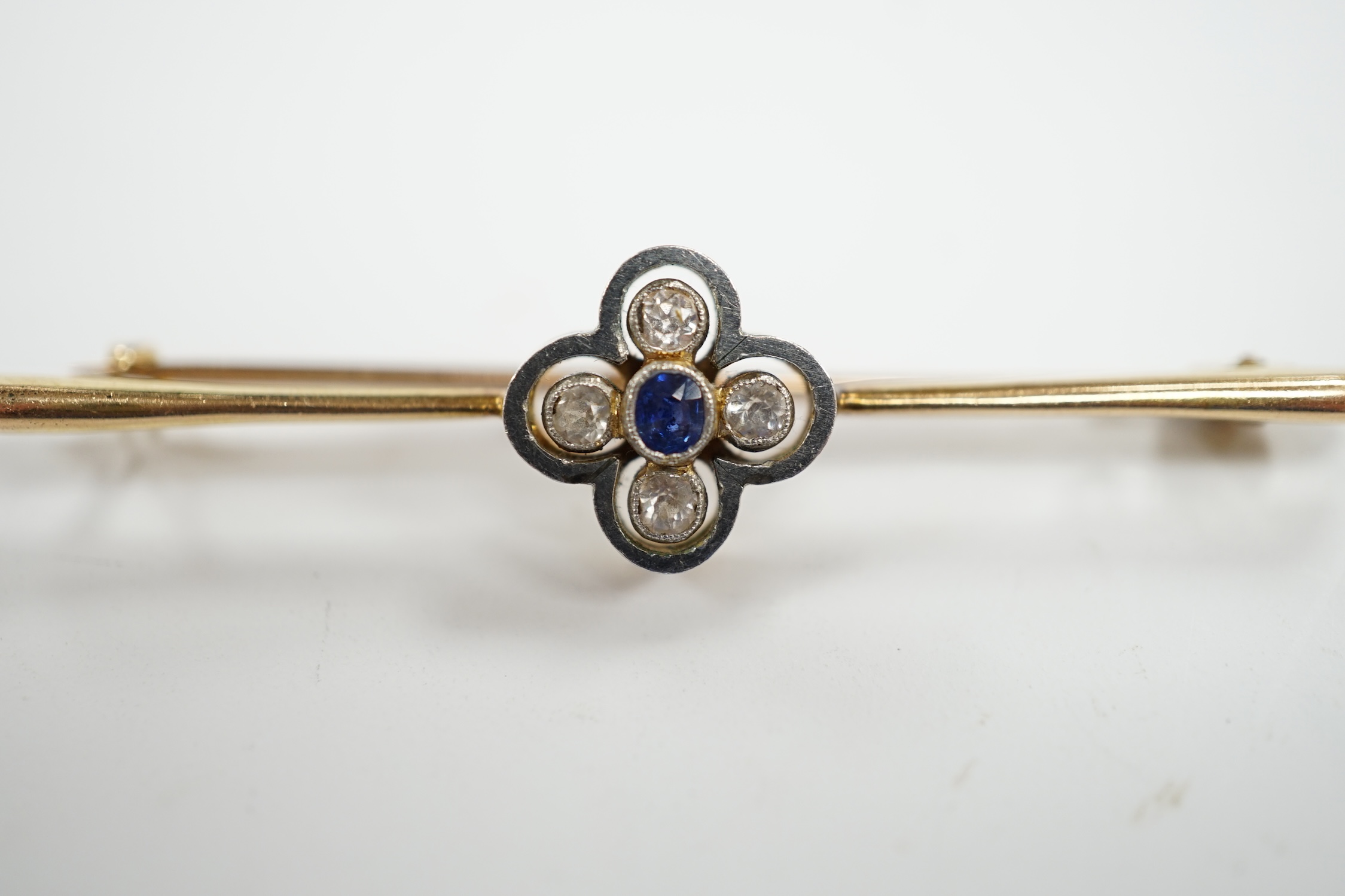 An Edwardian 15ct, sapphire and simulated diamond set four stone bar brooch, 55mm, gross weight 4.9 grams.